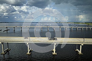 Barron Collier Bridge and Gilchrist Bridge in Florida with moving traffic. Transportation infrastructure in Charlotte