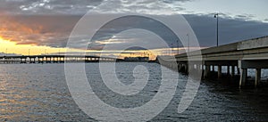 Barron Collier Bridge and Gilchrist Bridge in Florida with moving traffic. Transportation infrastructure in Charlotte