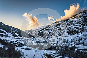 Bars, restaurants, hotels and residential building of El Tarter and Soldeu town at sunset, Andorra photo