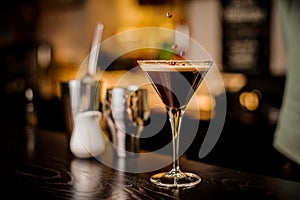 Bartender decorated espresso cocktail drink white foam coffee bean photo