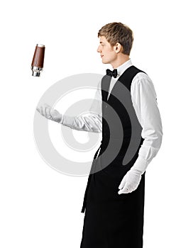 Bartender juggling with shaker and making cocktail