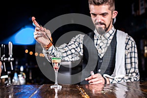 Bartender makes a cocktail at the brasserie