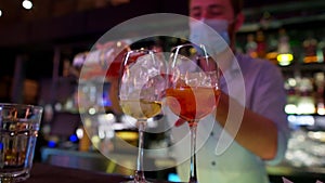 Bartender makes cocktails close up