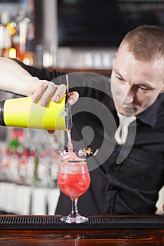 Bartender is making cocktail