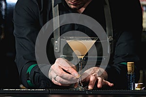 Bartender making relaxing cocktail