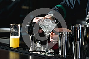 Bartender making relaxing cocktail