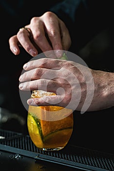 Bartender making relaxing cocktail