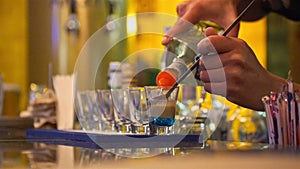 Bartender Making Tequila Shots - Side Angle