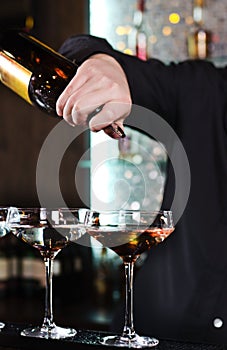 Bartender mixing alcoholic cocktails