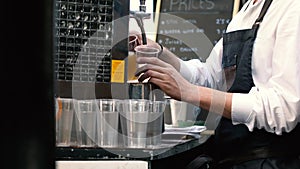 Bartender pouring draught beer