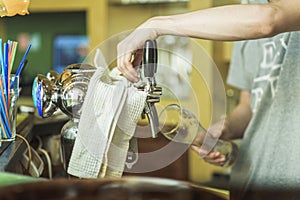 Bartender pouring fresh beer