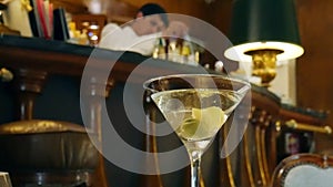 Bartender prepares a cocktail at the Spies Bar within the Hotel Palacio, Estoril, Portugal