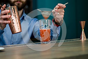 Bartender prepares a cocktail
