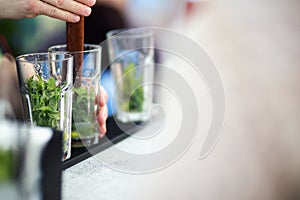 Bartender preparing cocktail for guests