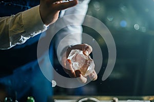 Bartender professionally working with ice photo