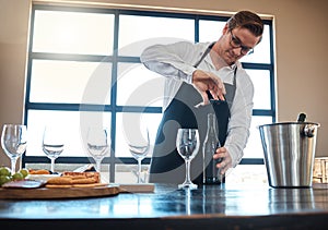 Bartender with red wine tasting at luxury restaurant or vineyard and vintage alcohol bottle and glasses for fine dining