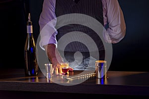 Bartender serving B-52 cocktail
