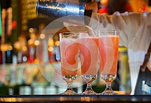 Bartender spills cocktails photo