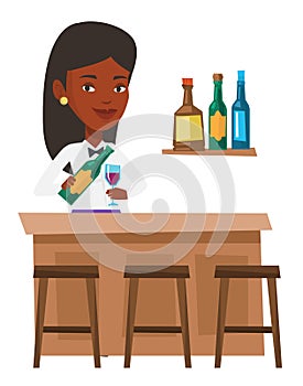 Bartender standing at the bar counter.