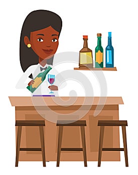 Bartender standing at the bar counter. photo