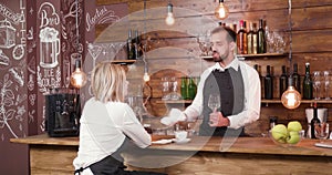 Bartender telling a story to his coworker after work