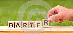 Barter is a word written on wooden blocks, concept