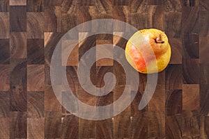 Bartlett pear on a butcher block wood cutting board