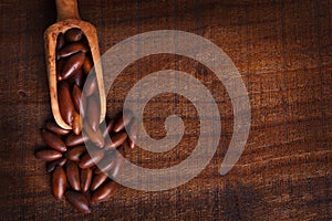 Baru almond on wooden background photo