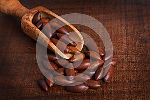 Baru almond on wooden background photo