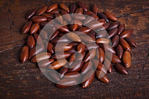 Baru almond on wooden background photo