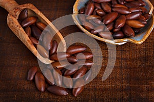 Baru almond on wooden background photo