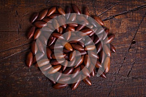 Baru almond on wooden background photo