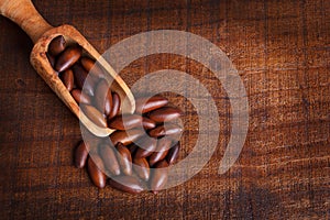 Baru almond on wooden background photo