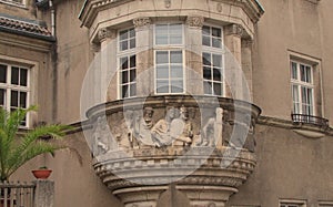 Bas-relief on the balcony of an old residential building in Mason, Germany.