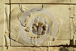 Bas relief of a bull and a lion at the ruins of Persepolis in Shiraz, Iran.