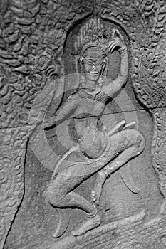 Bas-relief carving at a ruined temple in Angkor Wat - Siem Reap, Cambodia