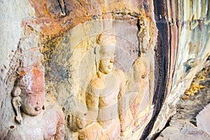 Bas relief carvings in a cliff face near Siem Riep Angkor Preah Viharn Thai border in Cambodia