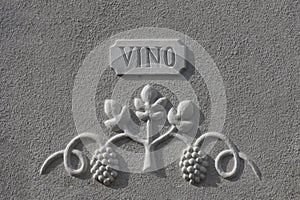 Bas-relief depicting grapes, with the inscription wine