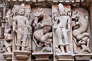 Bas-relief at famous ancient temple in Khajuraho, India photo