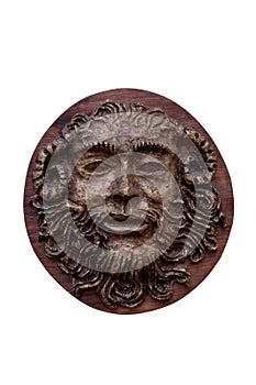 Bas-relief Faunus of the Greek deity made on wood isolated on w