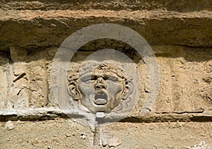 Bas relief of a human head. Lucca Tuscany Italy