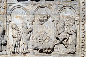 Bas-relief of Maestro Nicolo` 12th century, group to the right of the door of the Basilica of St Zeno in Verona photo