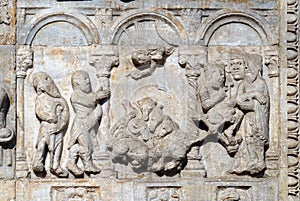 Bas-relief of Maestro Nicolo` 12th century, group to the right of the door of the Basilica of St Zeno in Verona photo