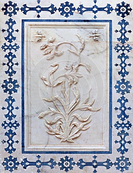 Bas-relief with marble flower at facade of Palase in Amer fort, Jaipur, Rajasthan, India