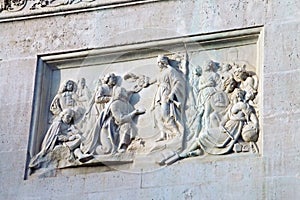 Bas-relief representing Felipe IV imposing the habit of Santiago to VelÃ¡zquez in the monument to King Felipe IV.