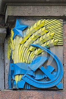 Bas-relief of the Soviet era patriots painted in colors of Ukrainian flag. Kiev