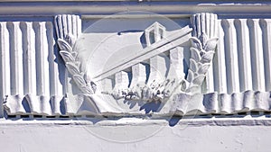 Bas-relief with Soviet symbols of labo photo