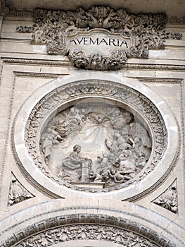 Bas relief statue of Mary with cherubs over the entrance to the cathedral at Granada, Andalusia, Spain, Espana