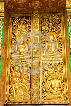 The bas-relief on the wall of the temple in Louangphabang, Laos. Close-up. Vertical.