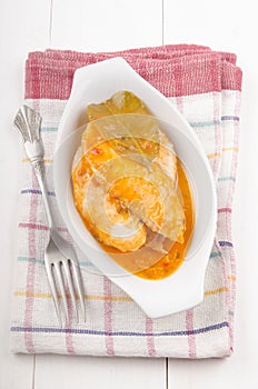 Basa fish with curry sauce in a bowl photo